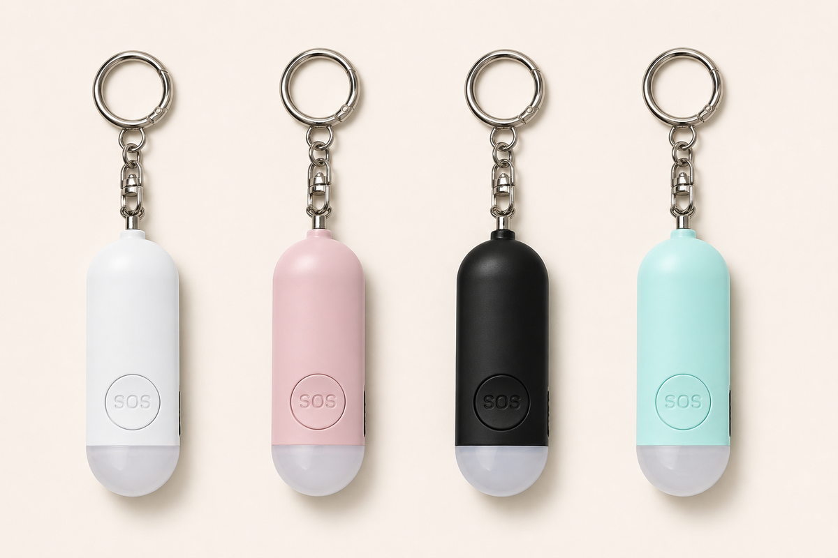 Lumae personal safety alarms in Black, White, Pink, and Mint